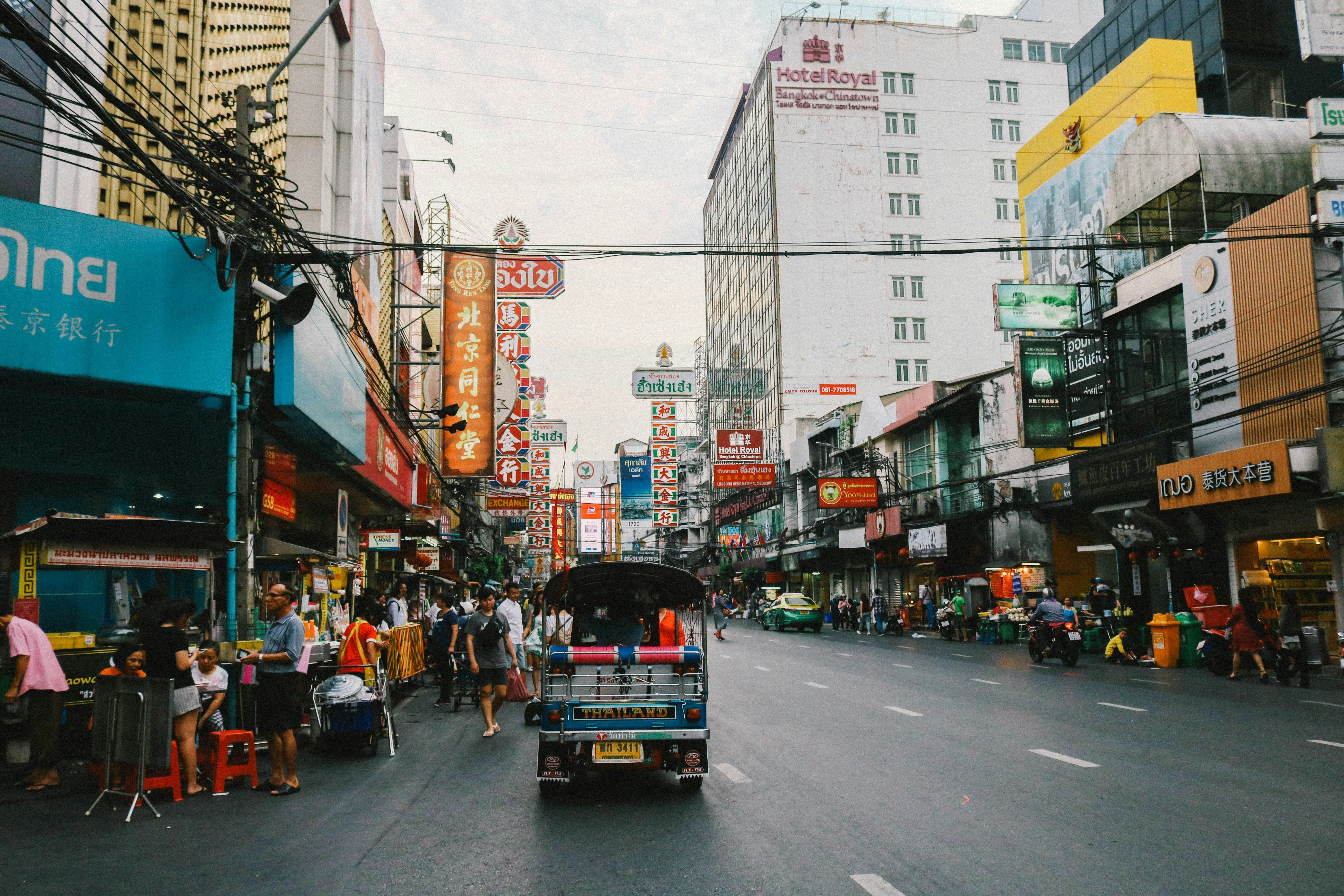 Expat couple reviewing travel insurance documents in Thailand